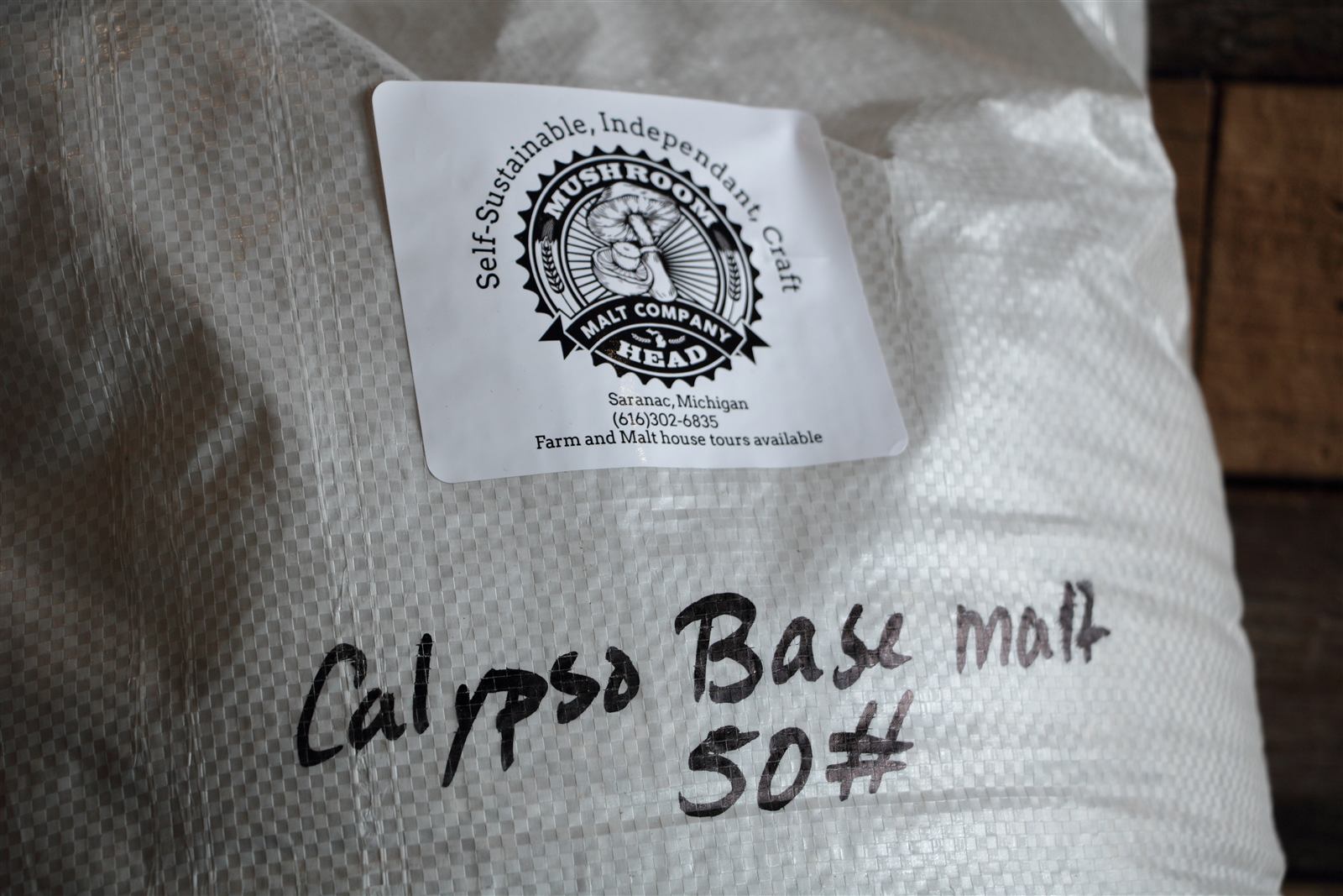 A sack of Michigan base malt in the brewhouse